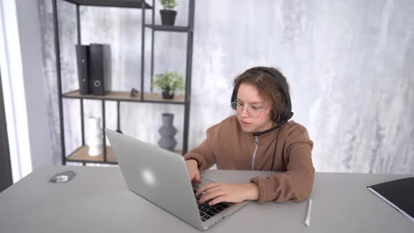 Portrait of a Cute Teenage Girl Having a Video Online Lesson