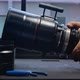Human hands are rotating the focusing system of the big movie camera zoom lens. - VideoHive Item for Sale
