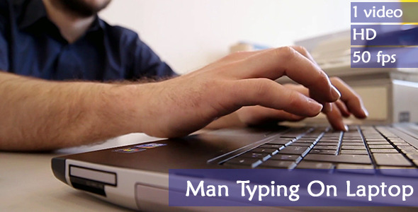 Man Typing On Laptop