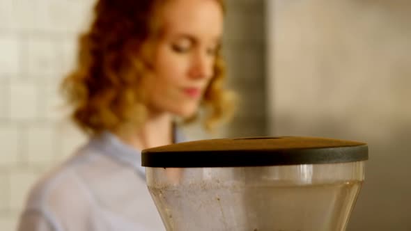 Female barista preparing coffee