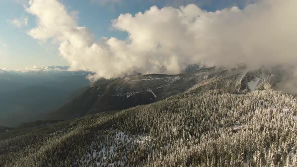 Aerial View of Canadian Nature Landscape on Top of Snow Covered Mountain