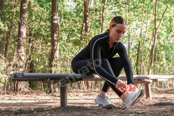 Fitness in the forest,Young woman doing fitness outdoors in the forest in summer, enjoying the fresh