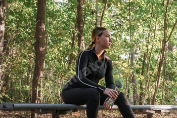 Fitness in the forest,Young woman doing fitness outdoors in the forest in summer, enjoying the fresh