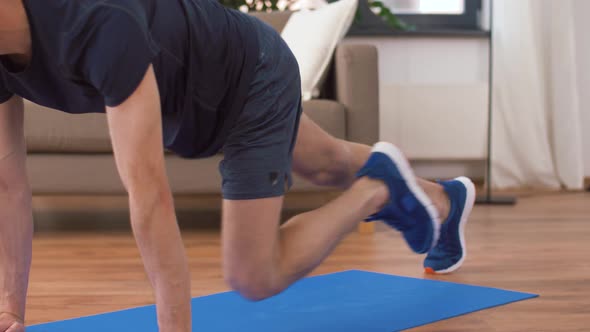Man Doing Running Plank Exercise at Home 6