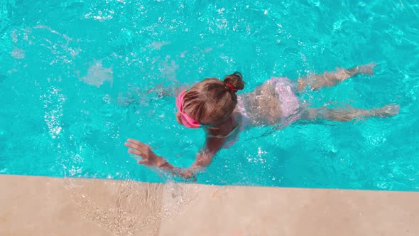 Girl Flounders In Swimming Pool