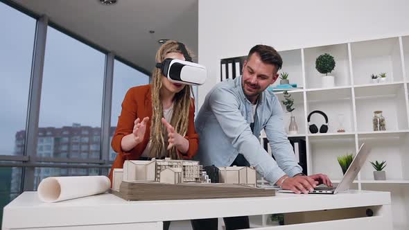 Architects which Working Together with Wooden Model of Future Buildings