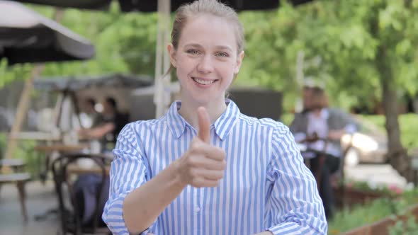 Tense Young Woman with Headache Sitting in Cafe Terrace