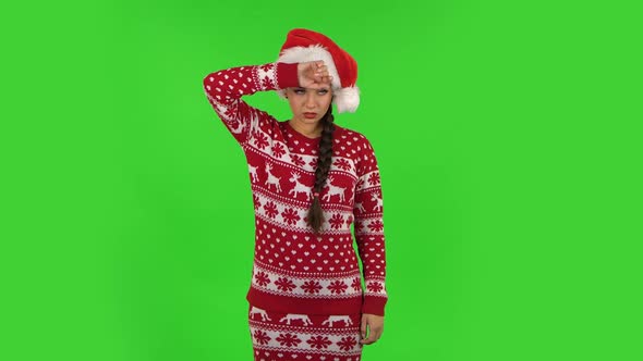 Sweety Girl in Santa Claus Hat Is Upset and Tired, Green Screen