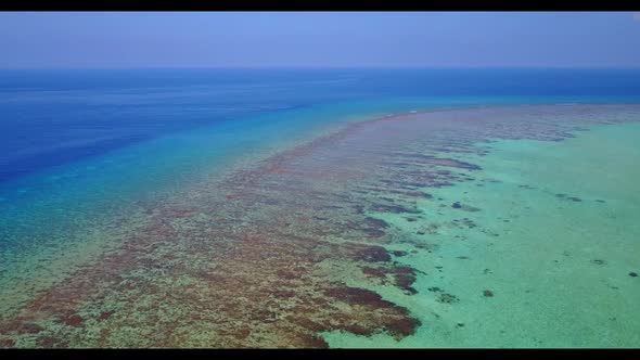 Aerial above abstract of luxury resort beach trip by turquoise water with bright sandy background of