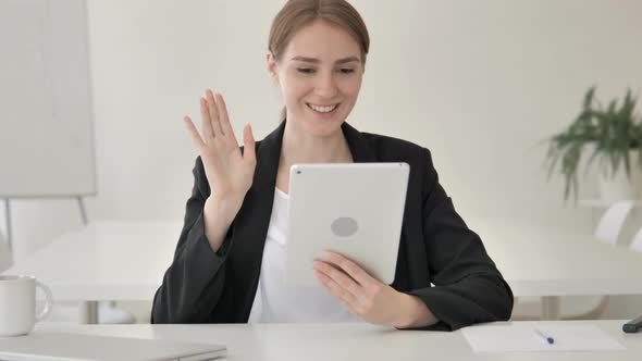 Online Video Chat on Tablet by Young Businesswoman