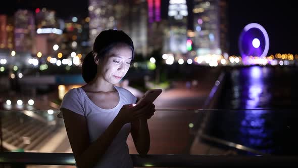 Woman use cellphone at night