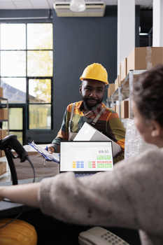 African american worker discussing products checklist