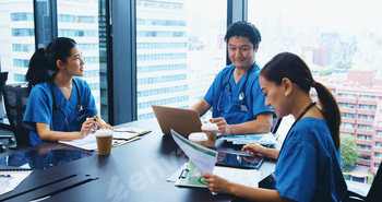 Asian people, nurse or team with documents in meeting for medical discussion, planning or budget at