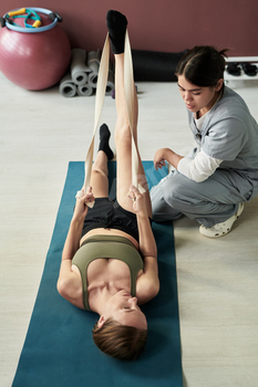 Assisting Client During Stretching Exercise Session