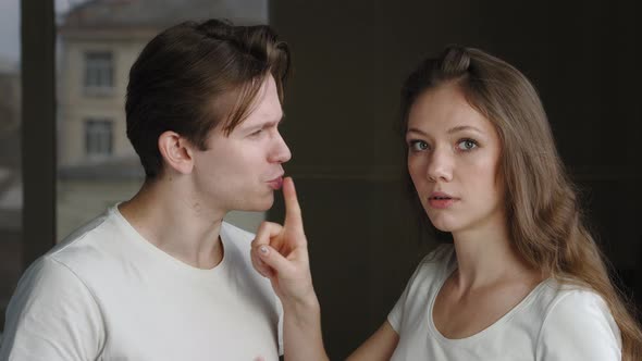 Two People Couple of Caucasian Woman and Man Talking Millennial Guy Tells Secret to Wife Girl Lady