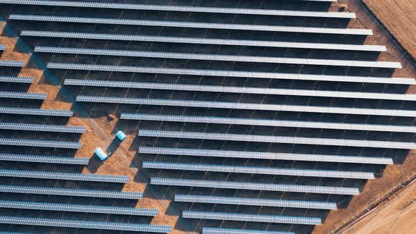 Solar power station panels in a row in the fields. Aerial view of solar power station.