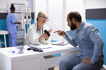 Doctor guides patient on medication