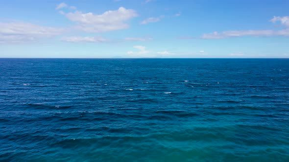 Blue Sea and Sky with Clouds View From the Drone