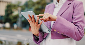 Online, hands and person with tablet in street for social networking, reading ebook and travel loca