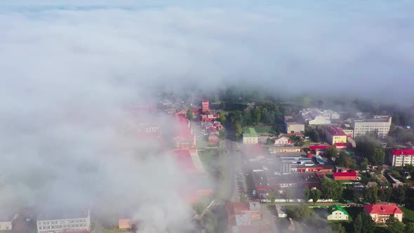 Fog Covers a Small Town in the Morning. View From Above