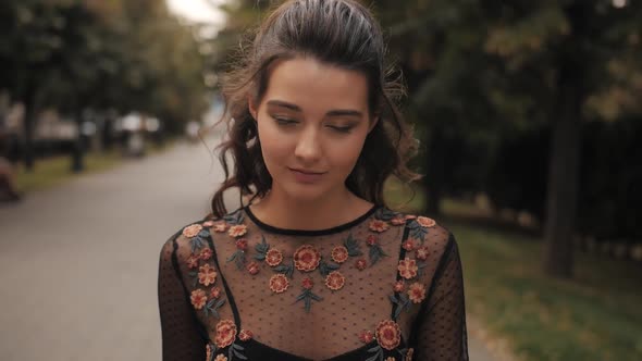 Fashion Walking Woman Portrait in Black Dress