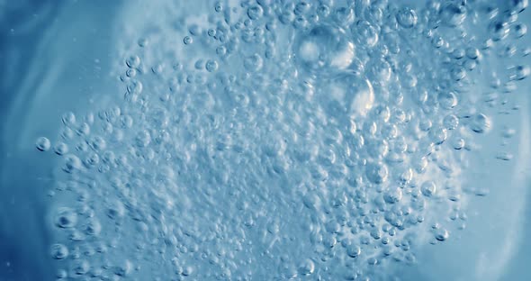 Oxygen Bubbles in Water on a Blue Abstract Background