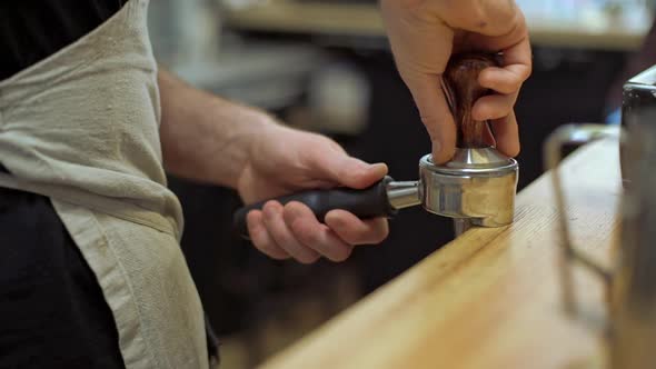 Barista Making Coffee in Coffeeshop