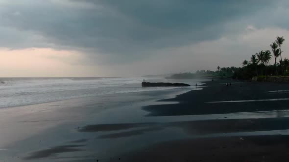 People on the Ocean at High Tide in Indonesia