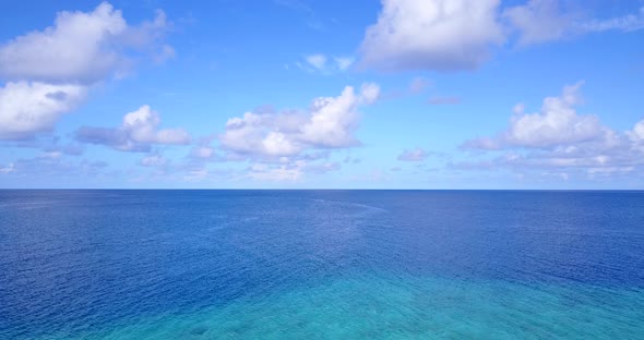 Beautiful aerial abstract shot of a white sandy paradise beach and blue ocean background in best qua