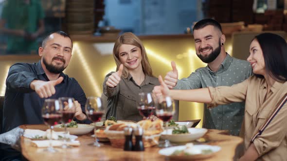 Group of Smiling Young People Rejoicing Showing Gesture Cool Thumb Up