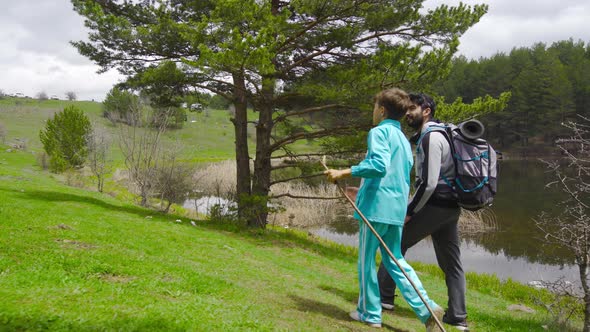 Father and son walking in nature.