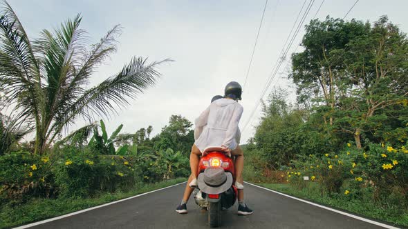 Love Couple on Red Motorbike in White Clothes to Go on Forest Road Trail Trip