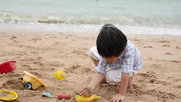 Cute Asian Child Playing On The Beach Slow Motion
