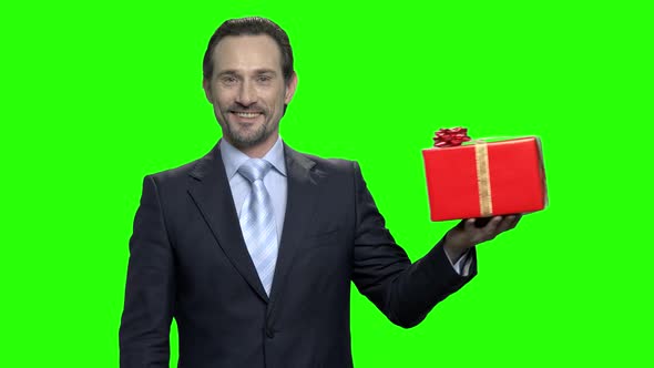 Businessman Presents Gift Box