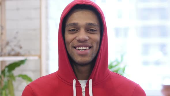 Portrait of Smiling AfroAmerican Man Looking at Camera in Office