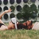 A young couple lying on the grass while playing with vr glasses - VideoHive Item for Sale