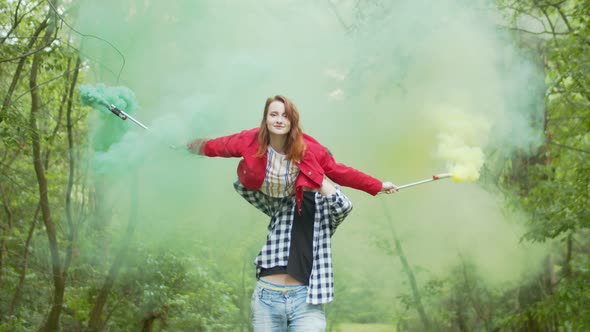 Male Carrying Woman with Smoke Bomb on Shoulder