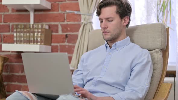 Ambitious Young Man Using Laptop