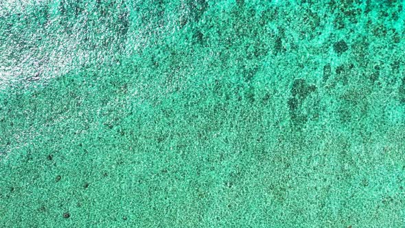 Tropical birds eye abstract view of a summer white paradise sand beach and blue ocean background in 