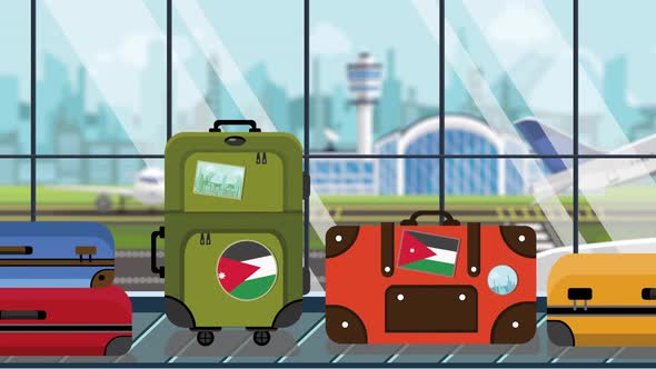 Baggage with Jordanian Flag Stickers on Carousel in Airport