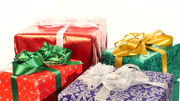 Different Boxes, Gifts Tied with Ribbons and Bows Isolated on White Background, Rotation