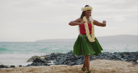 Woman performing Hawaiian hula on the beach