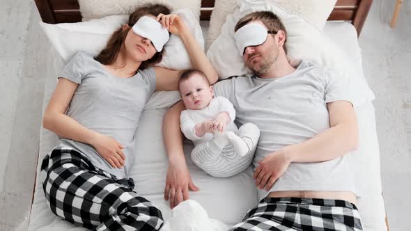 Family with Child in the Bed