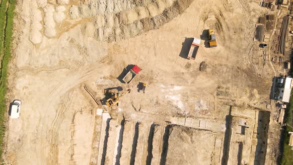 Bulldozer Works on Construction Site with Sand Aerial or Top View