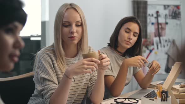 Women Discussing New Brands