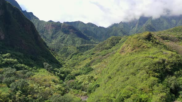 Lush West Maui Mountain range with clouds touching its peaks