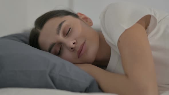 Hispanic Woman Sleeping in Bed Peacefully, Side Pose