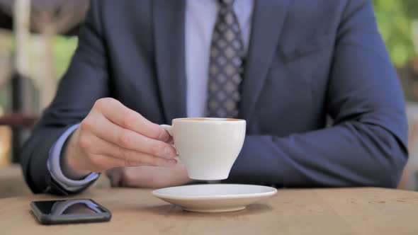 Cup on Table Businessman Drinking Coffee