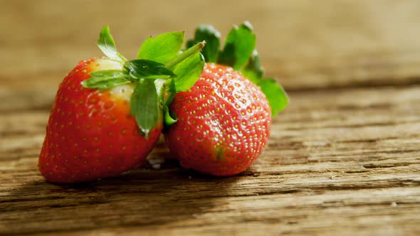 Strawberries placed on wooden surface 4K 4k