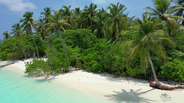 Beautiful overhead island view of a summer white paradise sand beach and turquoise sea background in